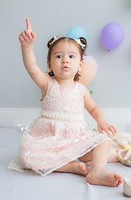 Toddler photo with balloons on the background in pastel tones - Nest Memories Baby Photography in London