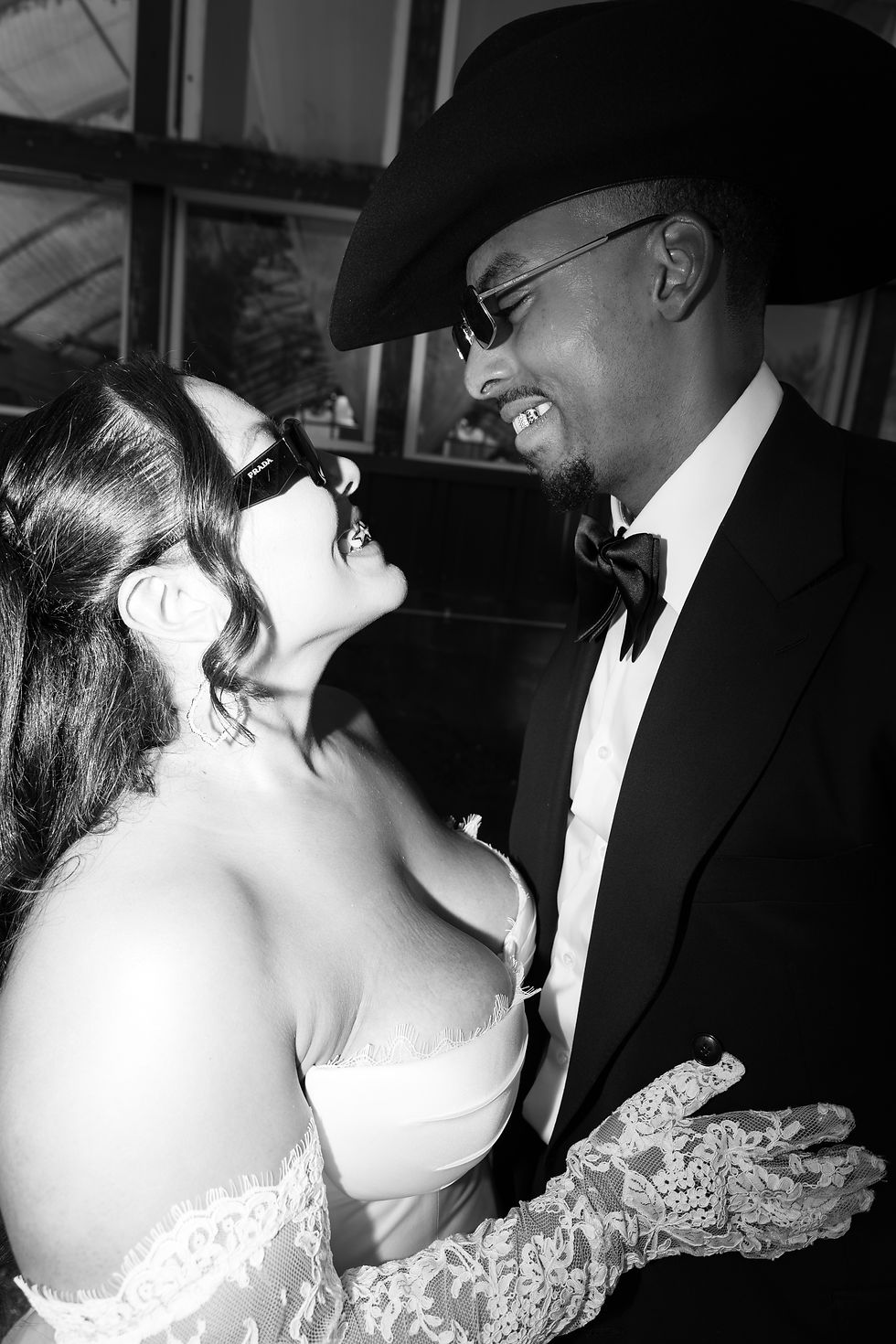 Black and white photo of Bride and Groom with grills