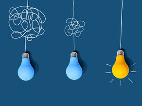 Image: Clarifying complex ideas through the glow of lightbulbs. Article: Illuminated: The Listening Skills That Help Clients See Themselves.  Discover how the co-active coaching skills of articulating, clarifying, and meta-view turn deep listening into clarity, insight, and lasting transformation.