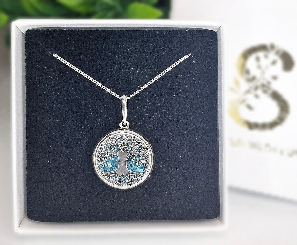 Tree of Life memorial pendant with ashes set inside a circular silver frame