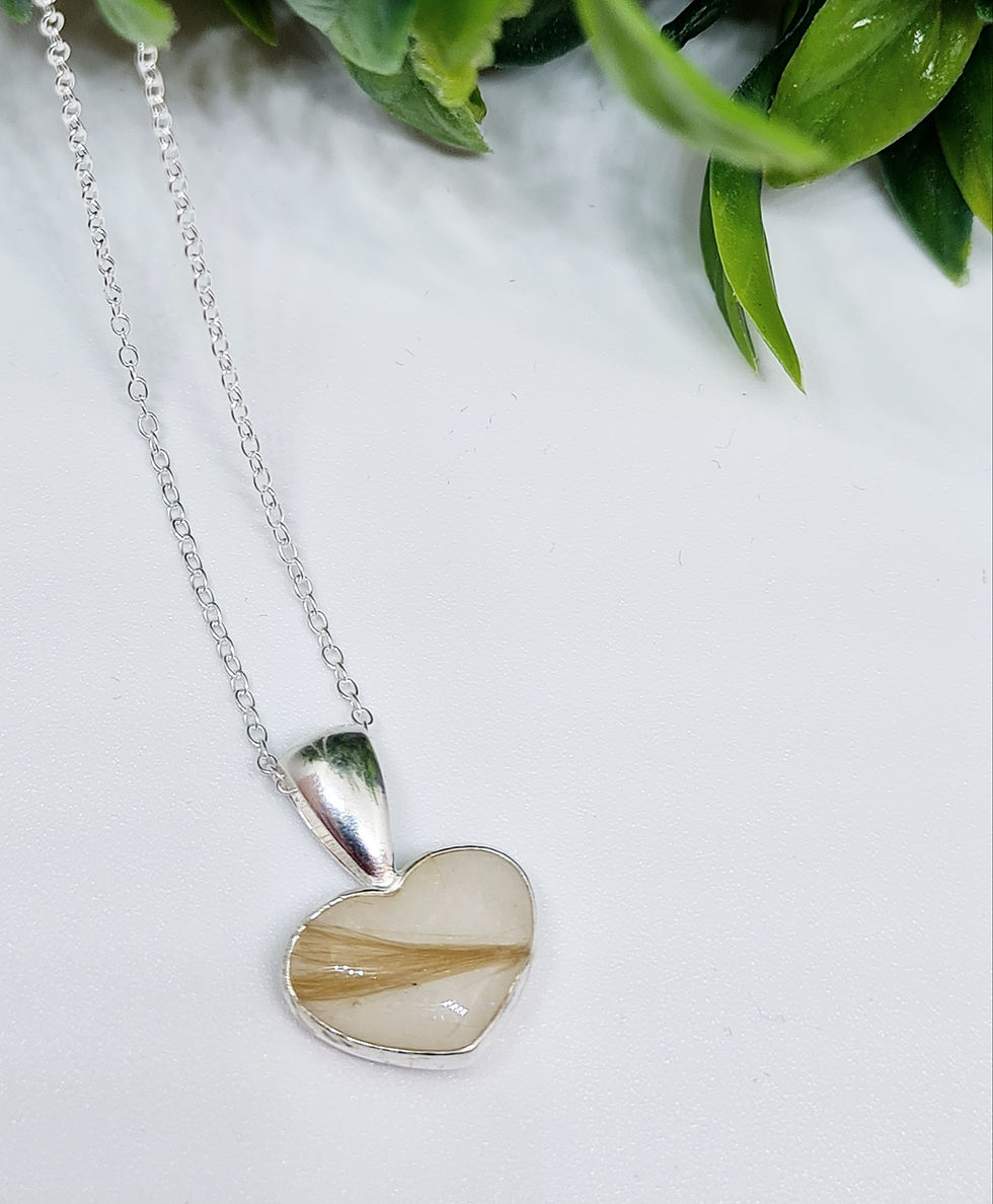 Thumbnail: Sterling silver heart-shaped breastmilk necklace with fine hair inclusion on 18" curb chain.