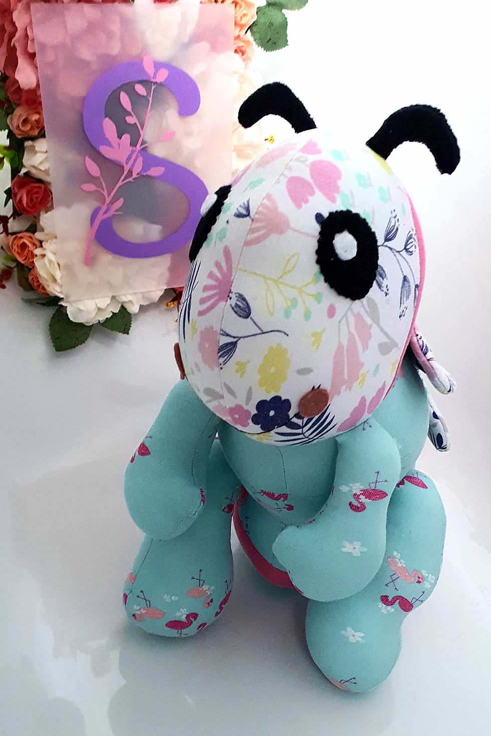 Thumbnail: Bee memory teddy made from pastel floral clothing with turquoise feet and wings