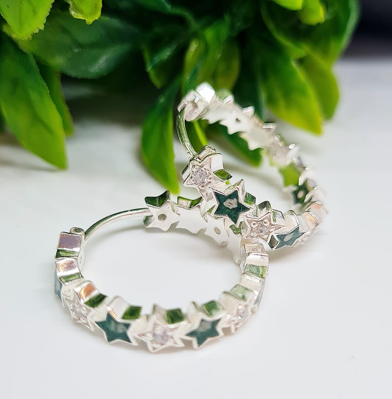 Thumbnail: Sterling silver hoop earrings with ashes resin-filled stars and diamanté birthstones, shown in sterling silver