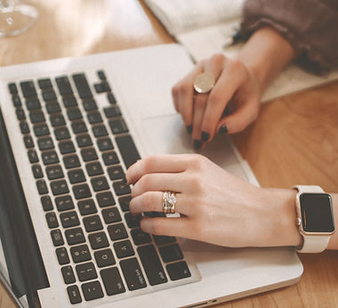 Hands placing an online order on a laptop, representing the personalised keepsake jewellery ordering process.