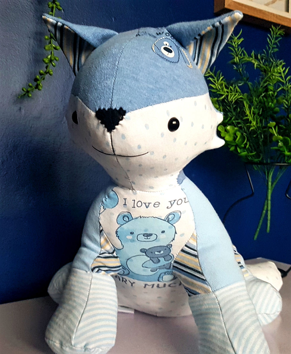Thumbnail: Weighted fox birthweight memory teddy made from pastel baby clothes, seated