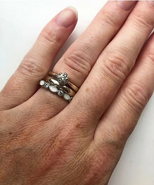 Close-up of keepsake rings worn on hand showing finished jewellery