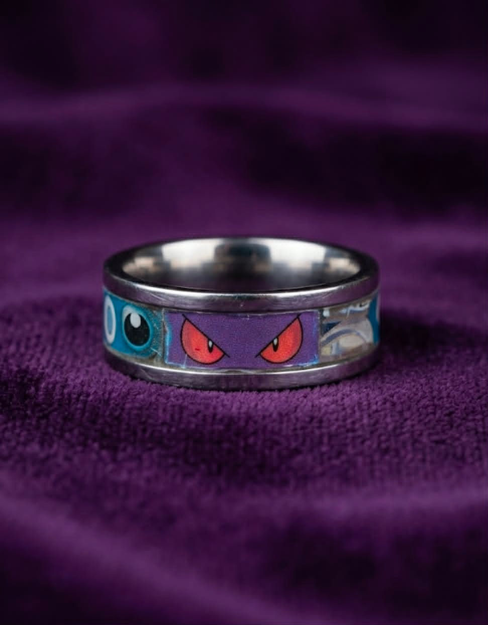 Thumbnail: Close-up of a custom Pokémon resin ring featuring authentic Pokémon TCG artwork inside the band.