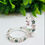 Thumbnail: Sterling silver hoop earrings with ashes resin-filled stars and diamanté birthstones, shown in sterling silver