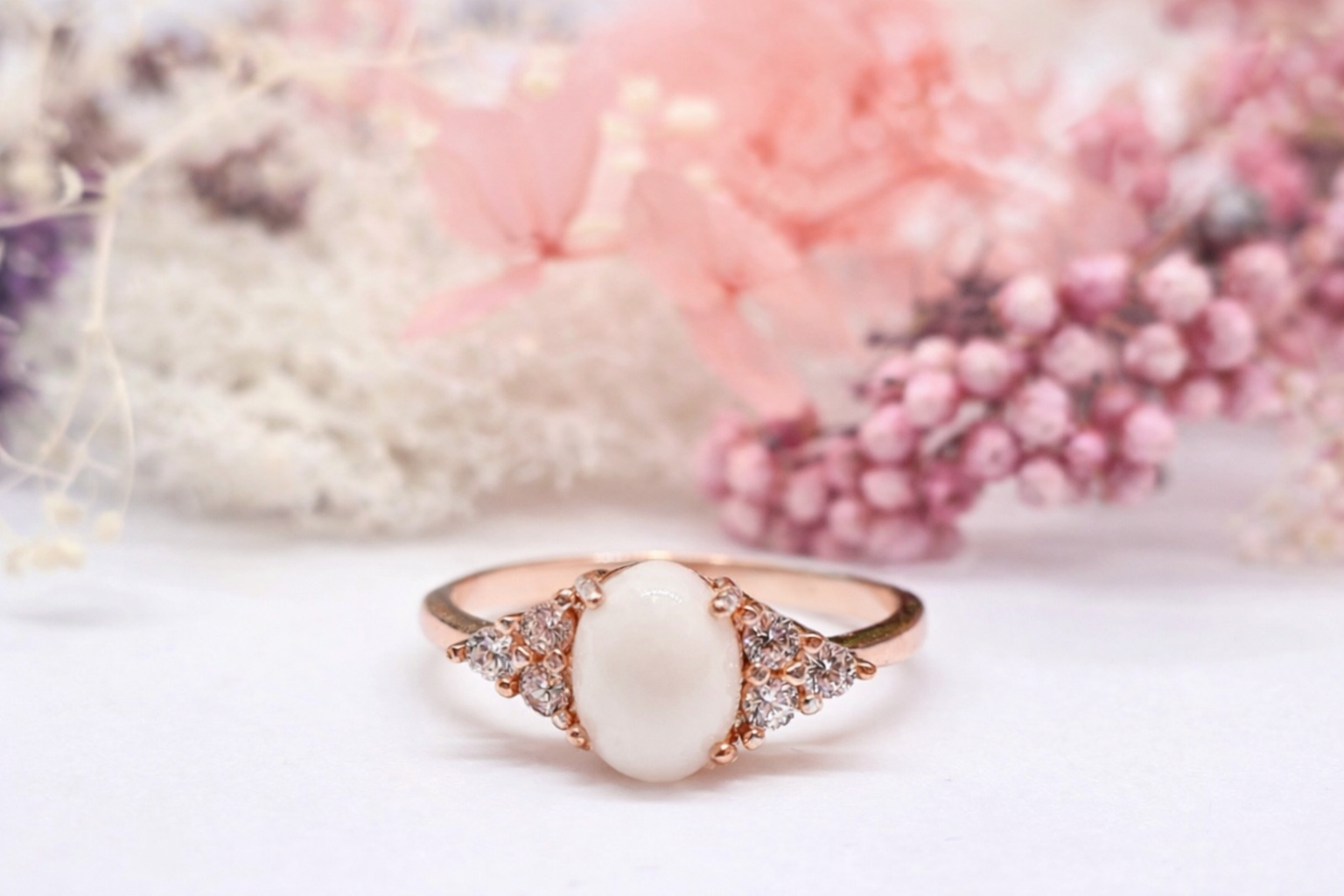 Freya breastmilk memorial ring with 8 × 6mm oval preserved milk stone and crystal accents