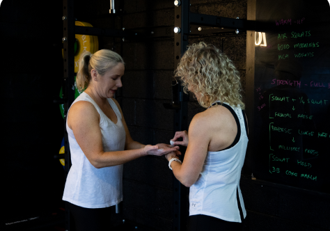 Personal trainer coaching a client one-to-one