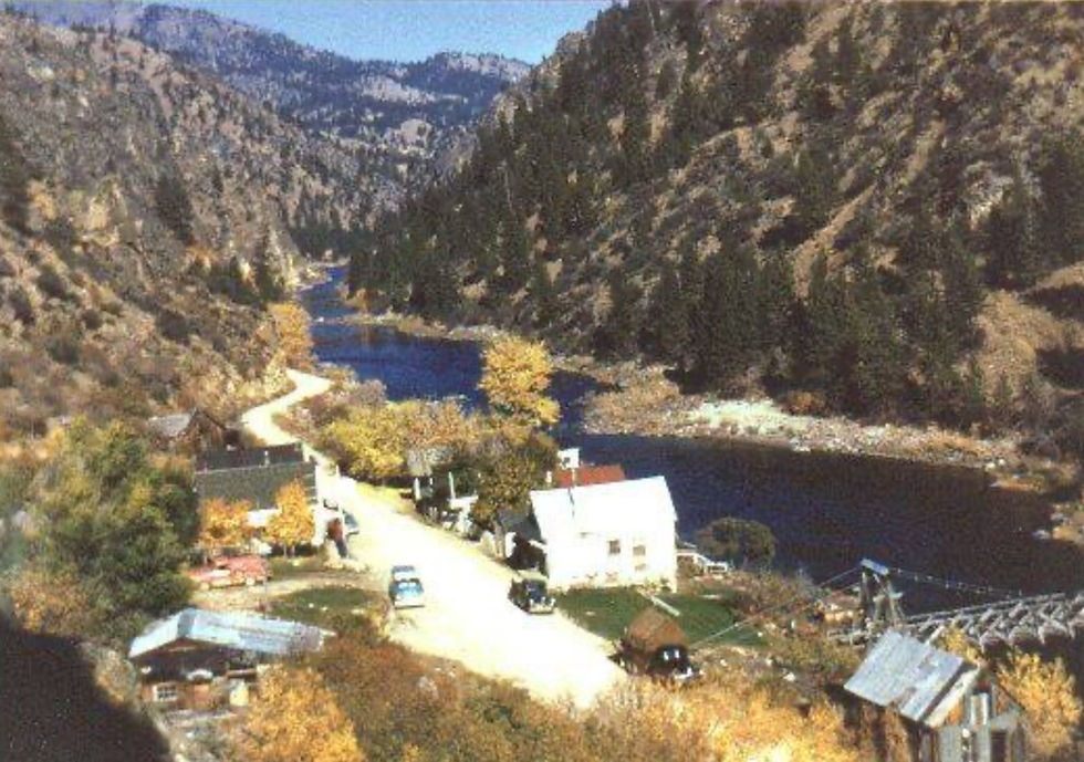 Birdseye view of Shoup Idaho in 1959, the river flowing from the east, remnants of the old mining town sitting on the bank of the river, the pack bridge still standing. 