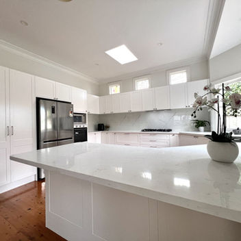 Spacious kitchen island with custom cabinetry, premium stone benchtops, and timeless design in a Willoughby home.