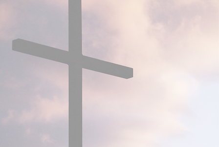 Large wooden cross with clouds in the background
