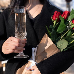 Woman holding Painted Horse Sparkling Wine & Red Roses