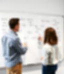 workflows being mapped out on a whiteboard.jpg
