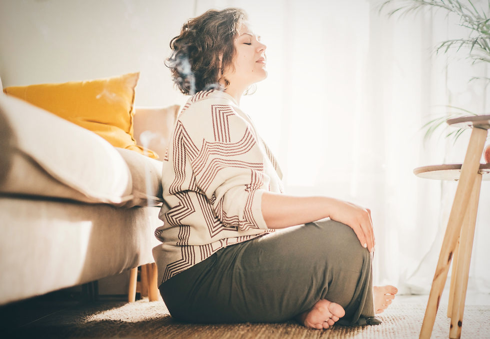 Woman meditating in her living room