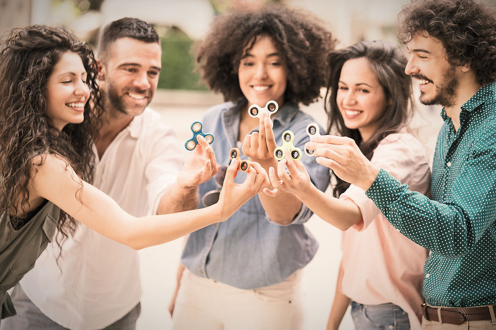 Group of diverse friends holding spinners
