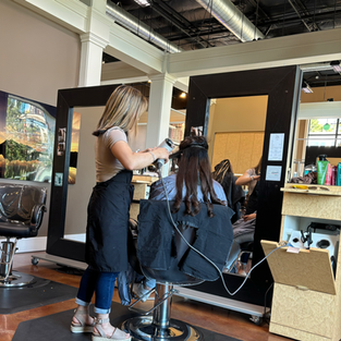 Anna giving a guess a Haircut at Blessings Salon Spa in Historic Fairhaven Bellingham Washington State