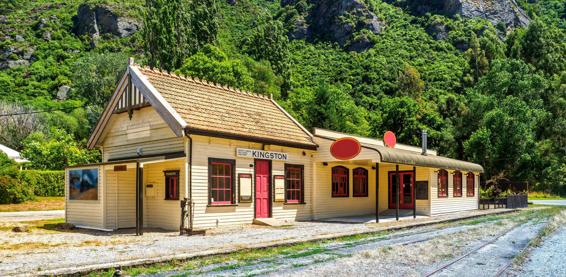 Kingston Railway Station: The historic timber-built Kingston Railway Station, featuring a cream and red color palette and set against a backdrop of dense native forest