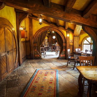 Hobbiton interior view of front door, hallway and rounded entrance to living area