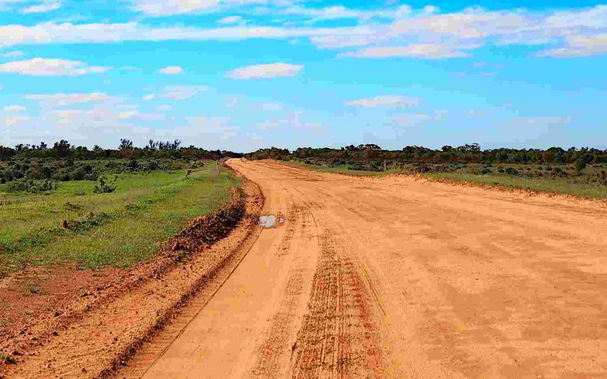 Narrow red dirt loop road around Mungo National Park is impassible when it rains