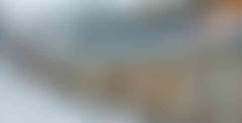 Vulcan Hotel, St Bathans: The iconic stone facade of the Vulcan Hotel in St Bathans, Otago, showing 19th-century gold rush era architecture on a light snowy morning.