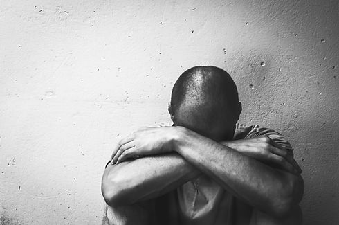 Homeless man drug and alcohol addict sit