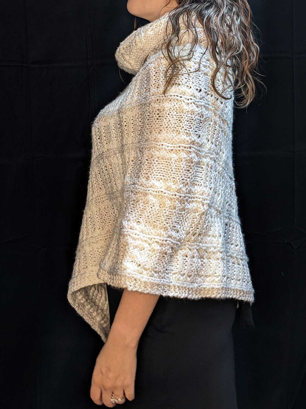 Thumbnail: Knitted Cuddly Poncho - Asymmetrical, side view, 100% Acrylic, Color: Quartz with subtle stripes, Special Features:  Very soft, asymmetrical drape, cowl collar, cable knit, JordynCherise