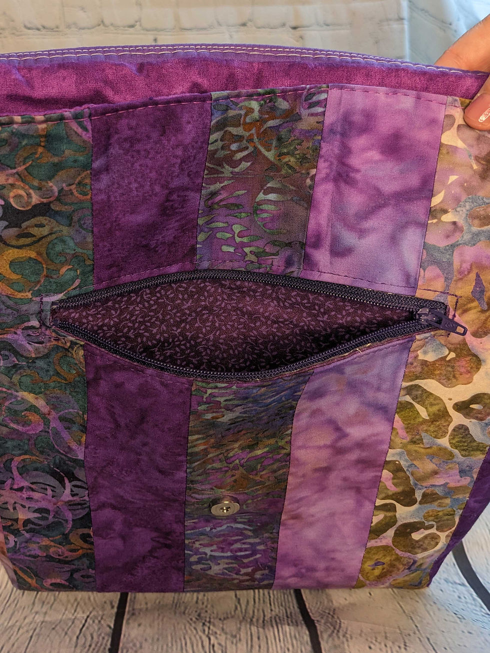 Thumbnail: Large Messenger Bag - zipper pocket - Purple Dreams print, 100% Cotton, Color: Batik Purples/Lavender/Green, Special Features: Strip pieced, magnetic closure, 5 pockets, cotton webbing strap, color coordinated zippers, size: Size: 13" W x 14"L, JordynCherise 