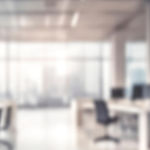 Blurred empty open space office. Abstract light bokeh at office interior background.jpg