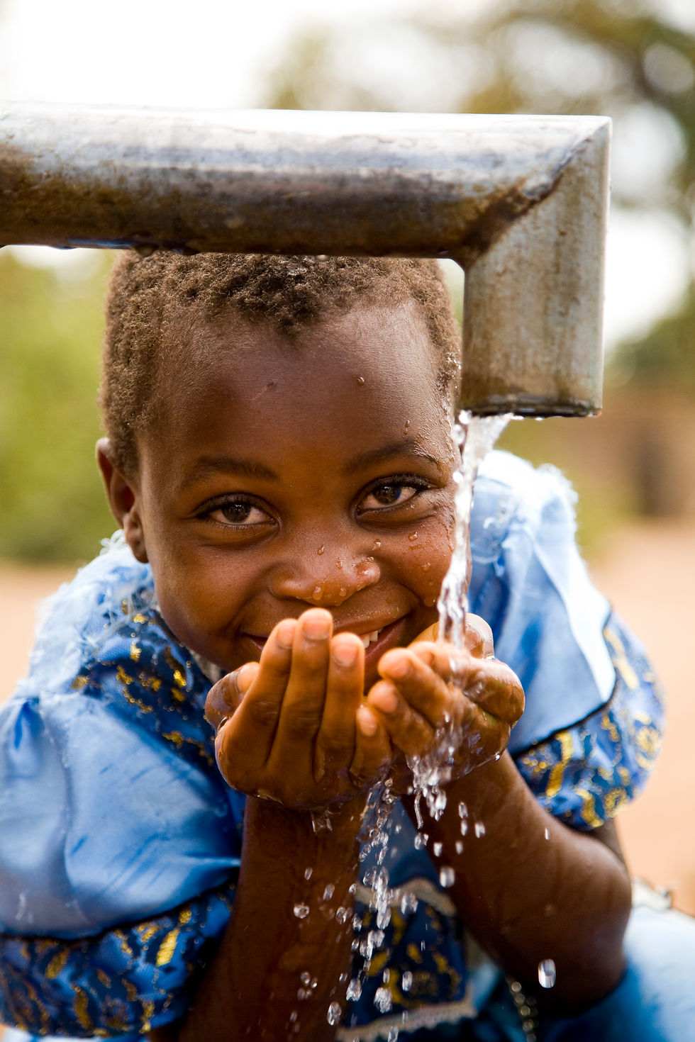 MAL Lilongwe WASH child at well dseigal (7).jpg