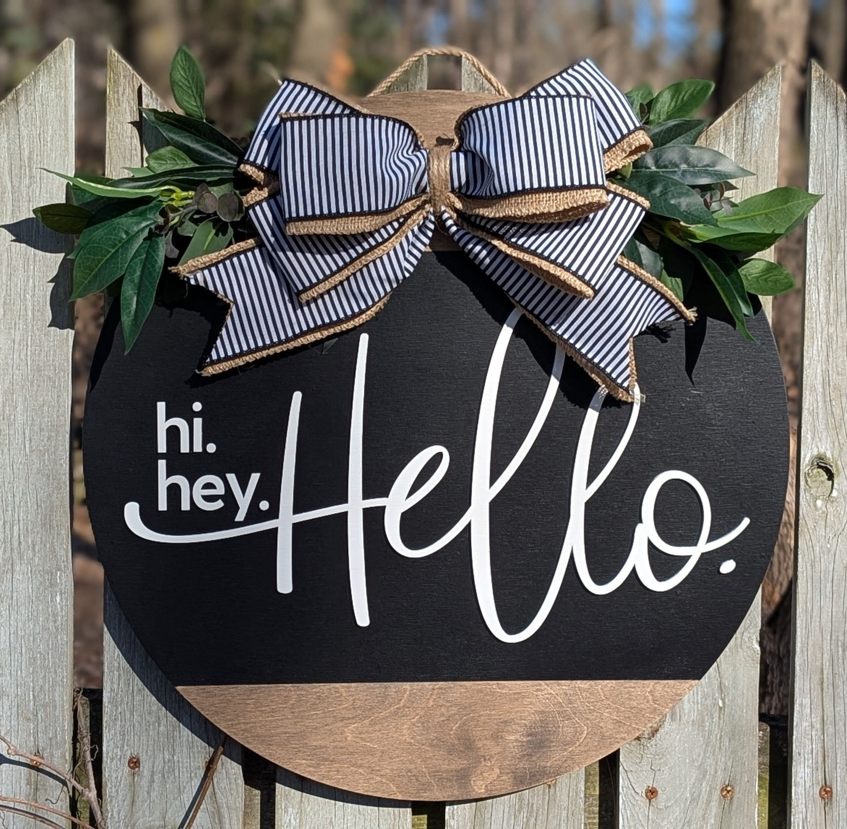 Hi. Hey. Hello. Door Hanger with bow and greenery