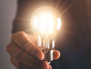 person holding a Light bulb 