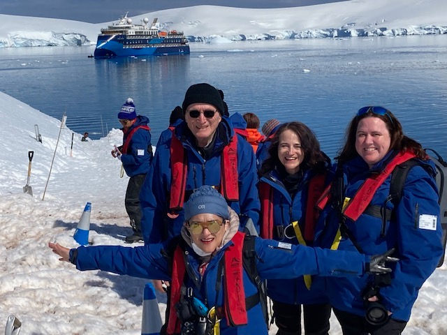 Nicole leads our family to Port Lockroy, Antarctica. Photo taken for Dr. Diane Jackson Schnoor, 2022