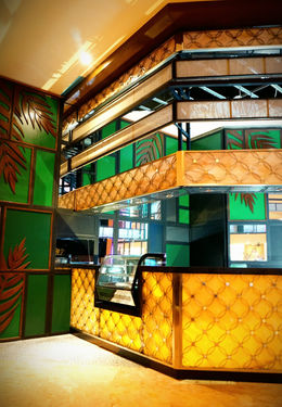 Hotel bar design by B&Ö with operational bar layout, illuminated backbar, durable finishes, and optimized bartender workflow.