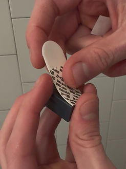 Secure mount piece to wall using a command strip