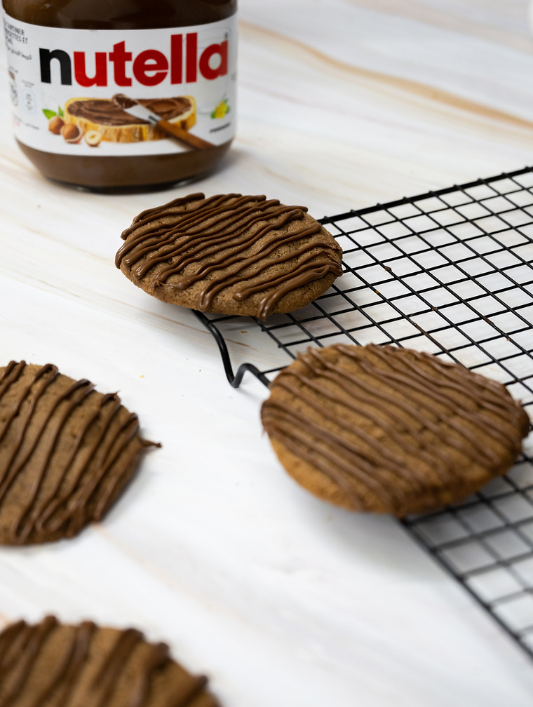 dip of Nutella on cookies image is yummy