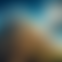 man with backpack scaling side of pyramid