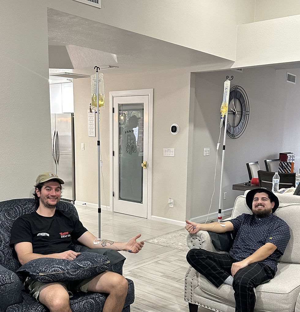 Two male patients comfortably receiving safe mobile IV therapy at home from Sunshine Mobile IV in Arizona