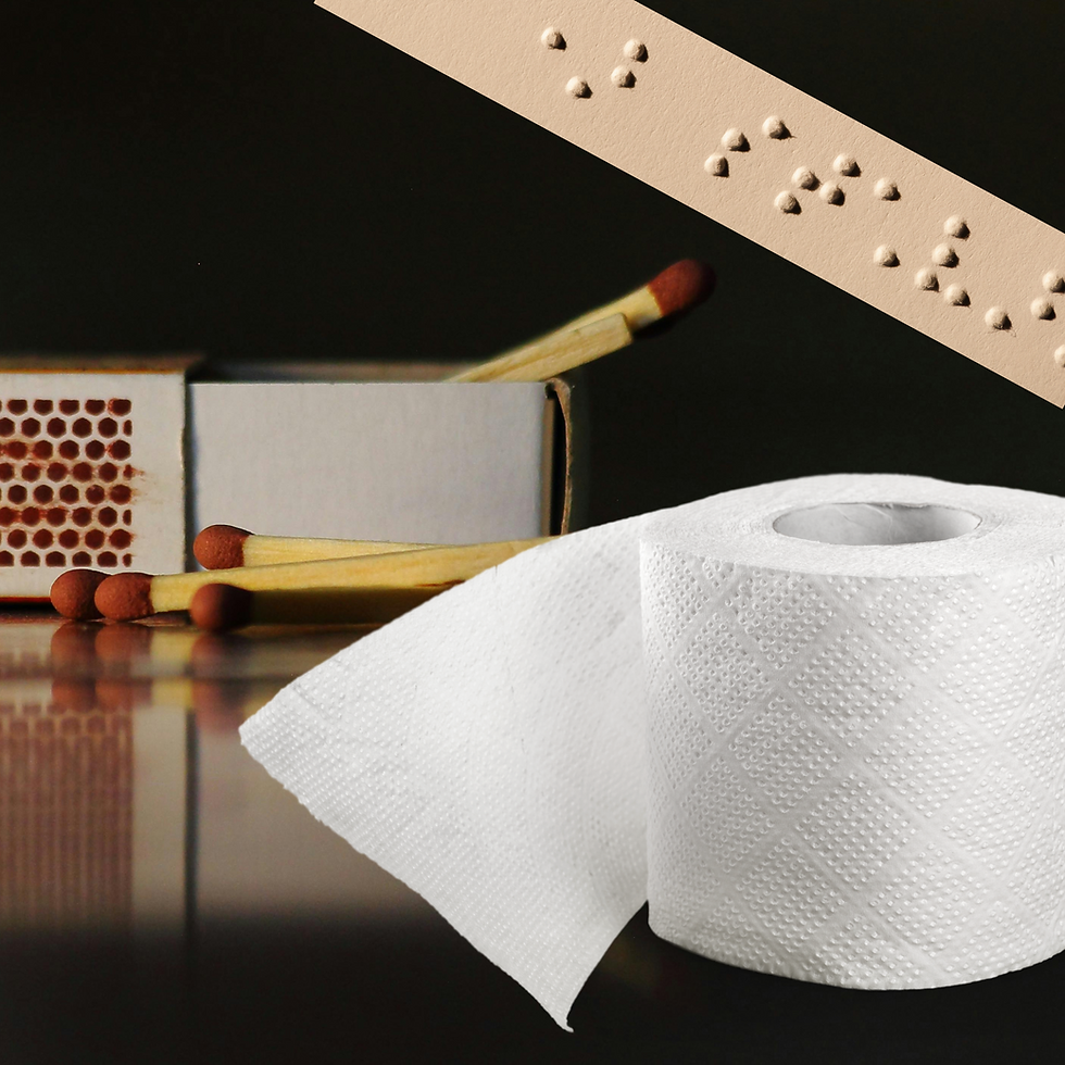 En tændstikæske, noget toiletpapir og en strimmel punktskrift.