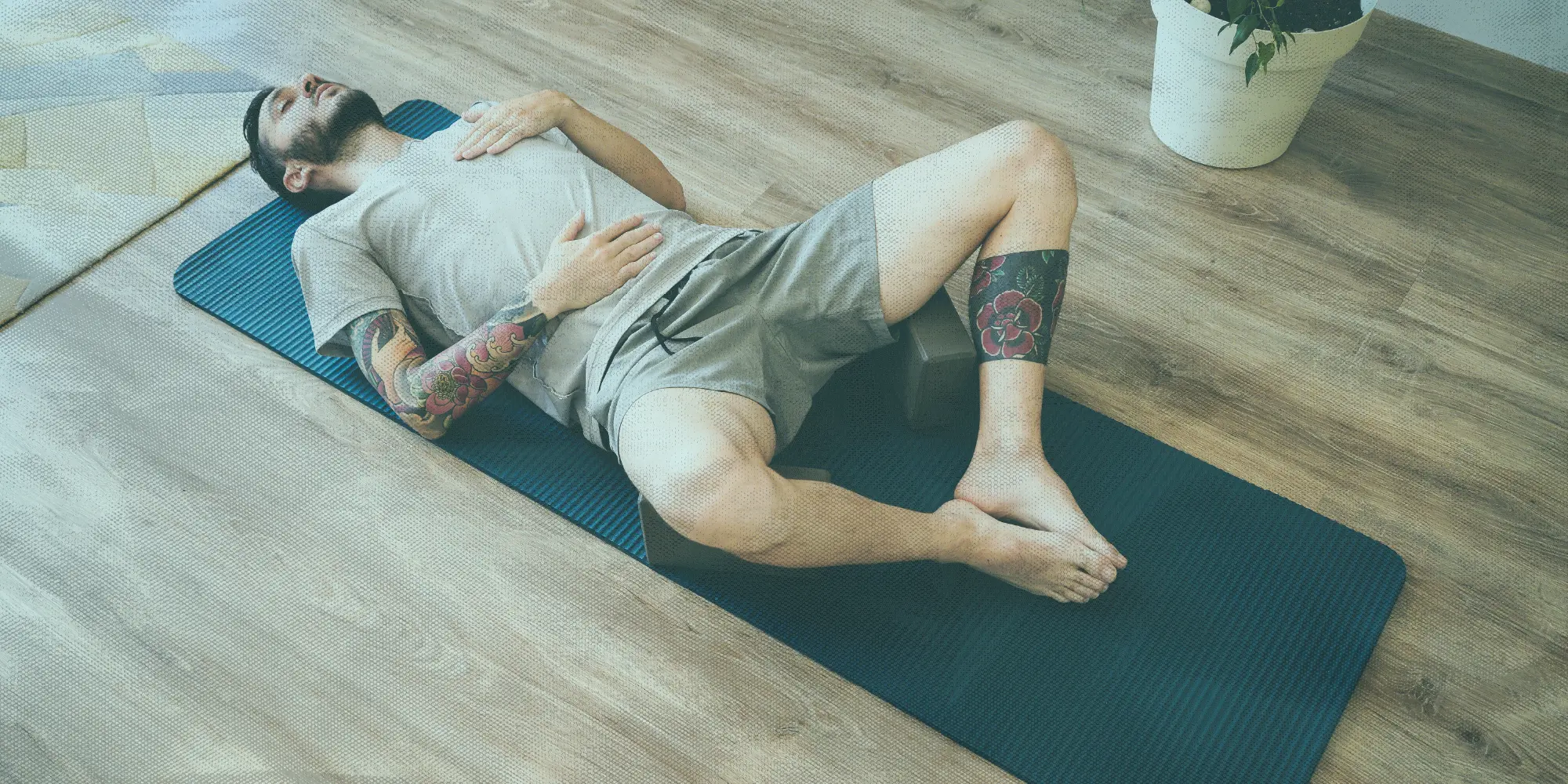 What To Do This Weekend | Health SZN | A man doing mindful breathing on a yoga mat