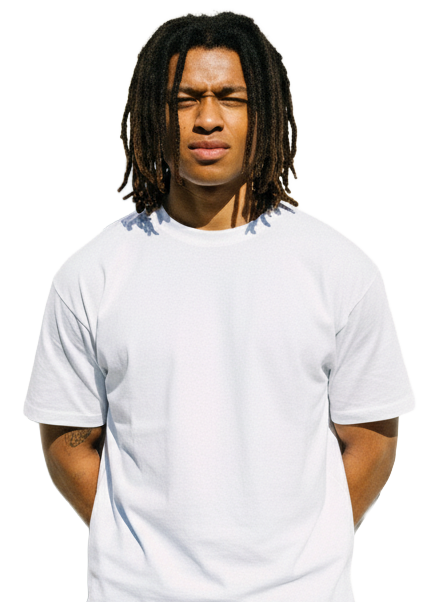 A man with dreadlocks is wearing a white t-shirt, standing against a neutral background.