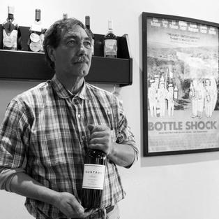 Gustavo Brambila, pictured in front of his award winning wines and his prize posession, the BottleShock movie poster, which he was featured in