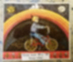 Thumbnail: Oracle card with illustration of child riding bike under a rainbow