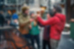 Group of people cheers with beers