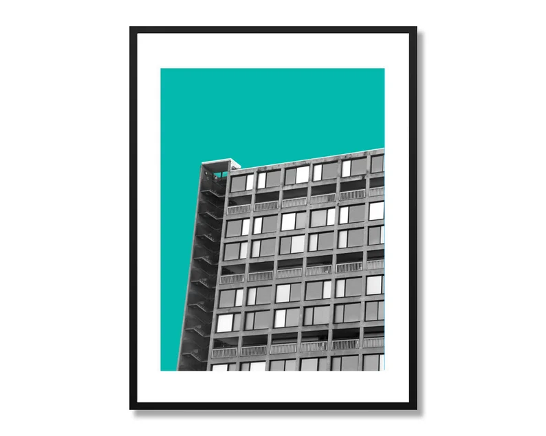 Thumbnail: Tall gray building against a teal sky
