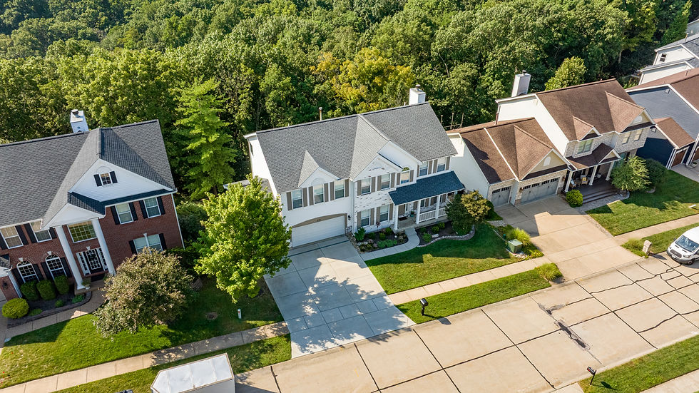 Aerial View of a Home with a Lush Backyard