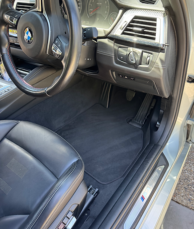 Interior car cleaning transformation: seats and carpets cleaned, leaving a fresh, like-new appearance.