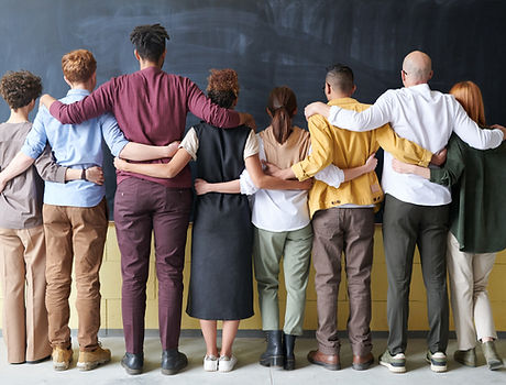 Canva - Group of People Standing Indoors