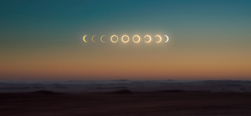 Phases of a solar eclipse over a desert landscape at dusk. The sky transitions from blue to orange, creating a serene atmosphere.
